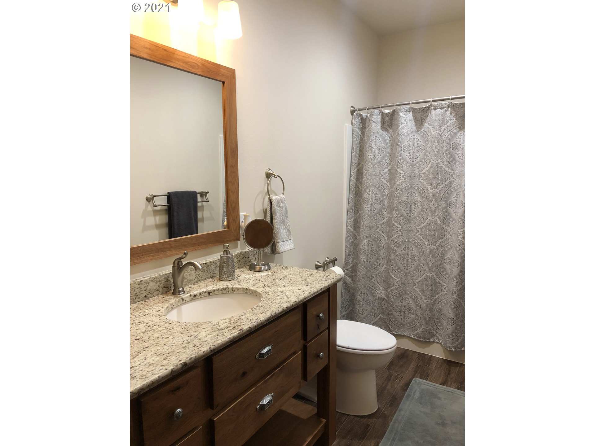 1304 Alpha Court Pendleton, OR 97801 - Photo 14 of 32 a bathroom with a granite countertop sink toilet and shower