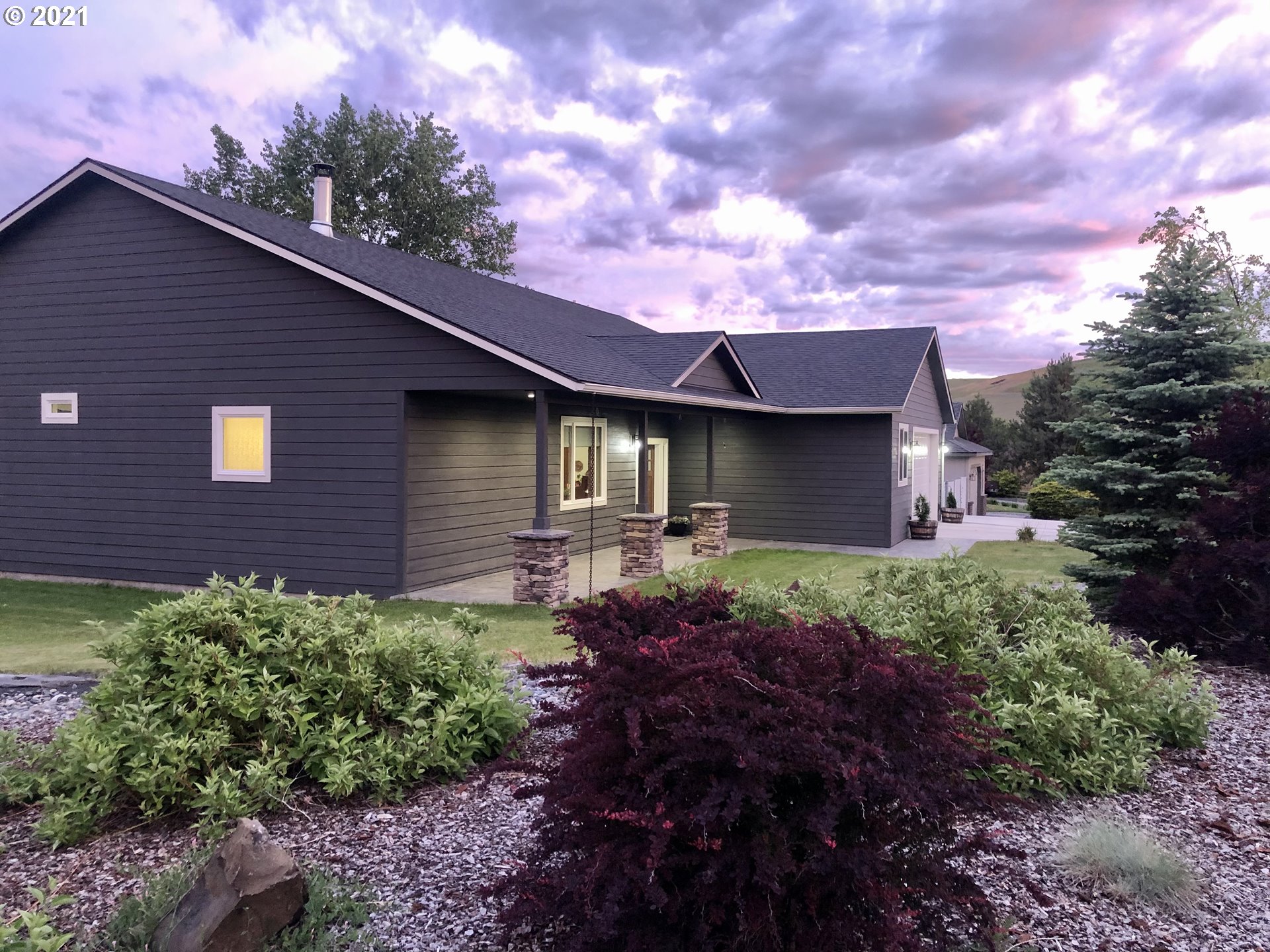 1304 Alpha Court Pendleton, OR 97801 - Photo 2 of 32 a front view of a house with a garden