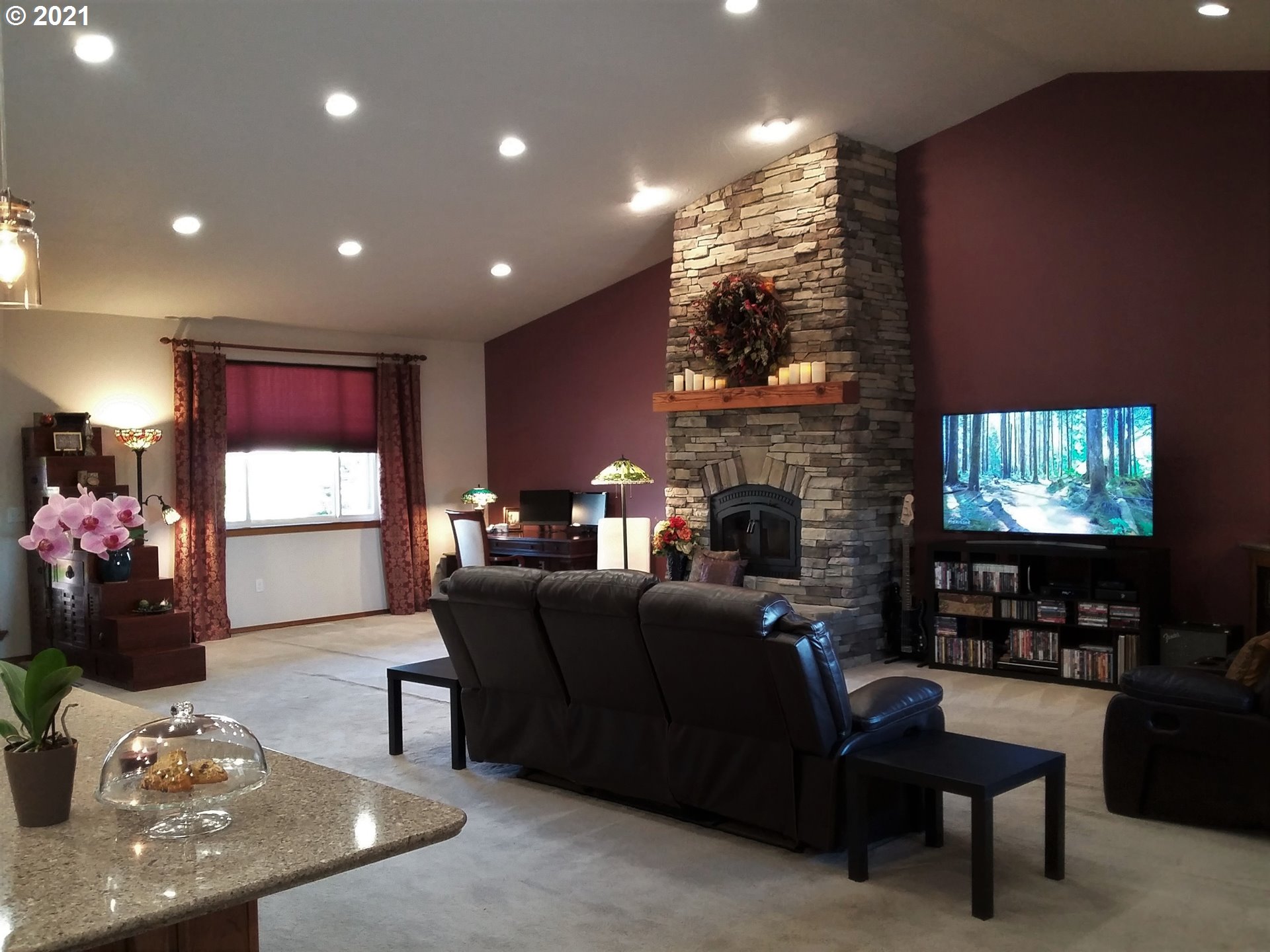 1304 Alpha Court Pendleton, OR 97801 - Photo 5 of 32 a living room with furniture a fireplace and a flat screen tv