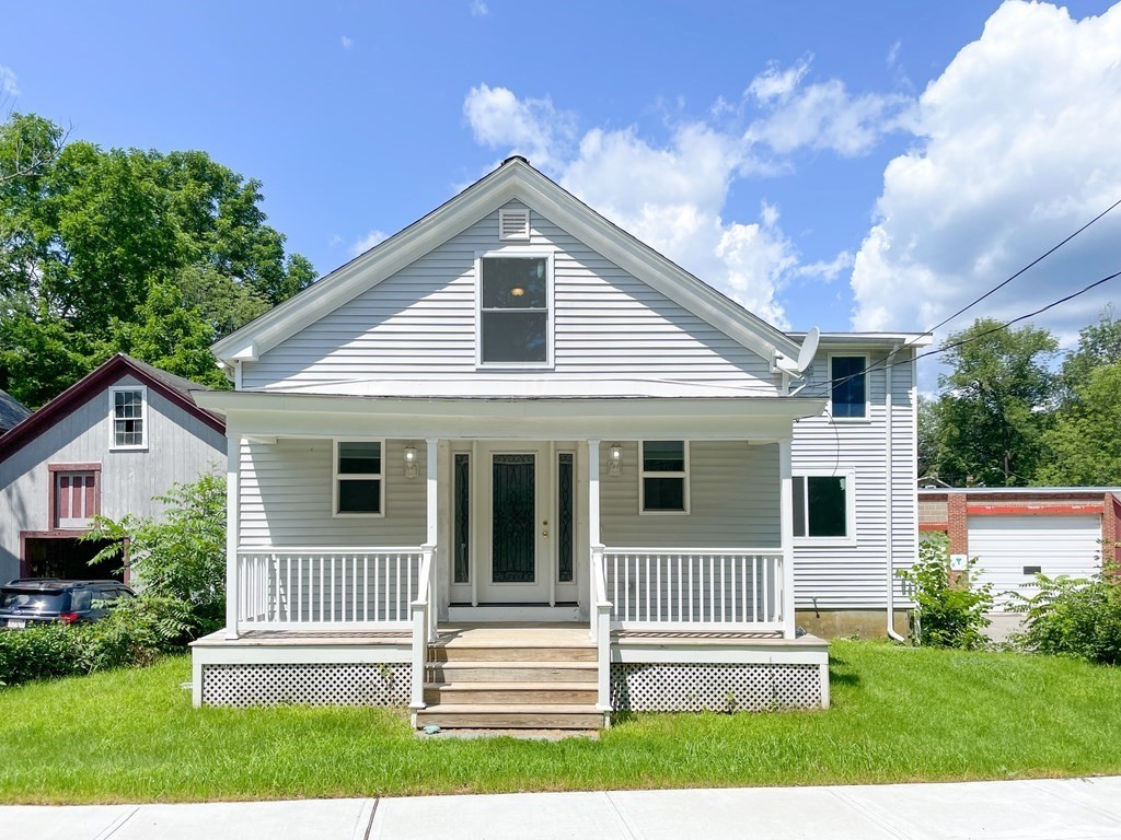 a view of a house with a yard