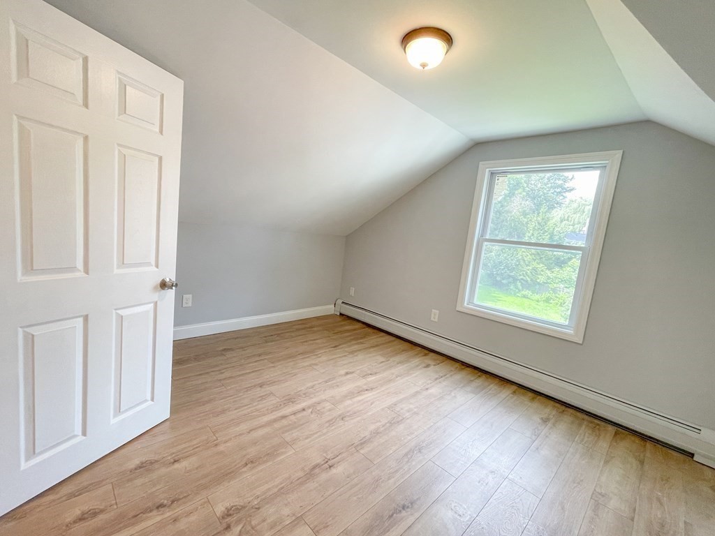 51 School Street North Barre, MA 01005 - Photo 20 of 35 an empty room with wooden floor and windows