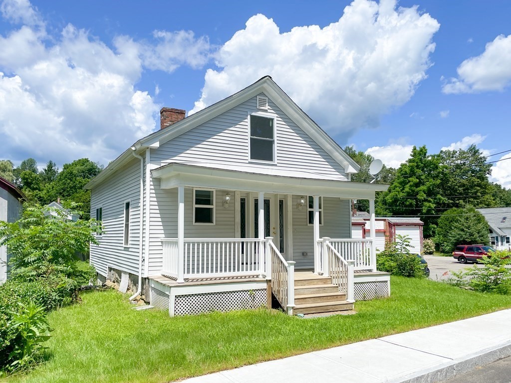 51 School Street North Barre, MA 01005 - Photo 2 of 35 a front view of a house with a yard