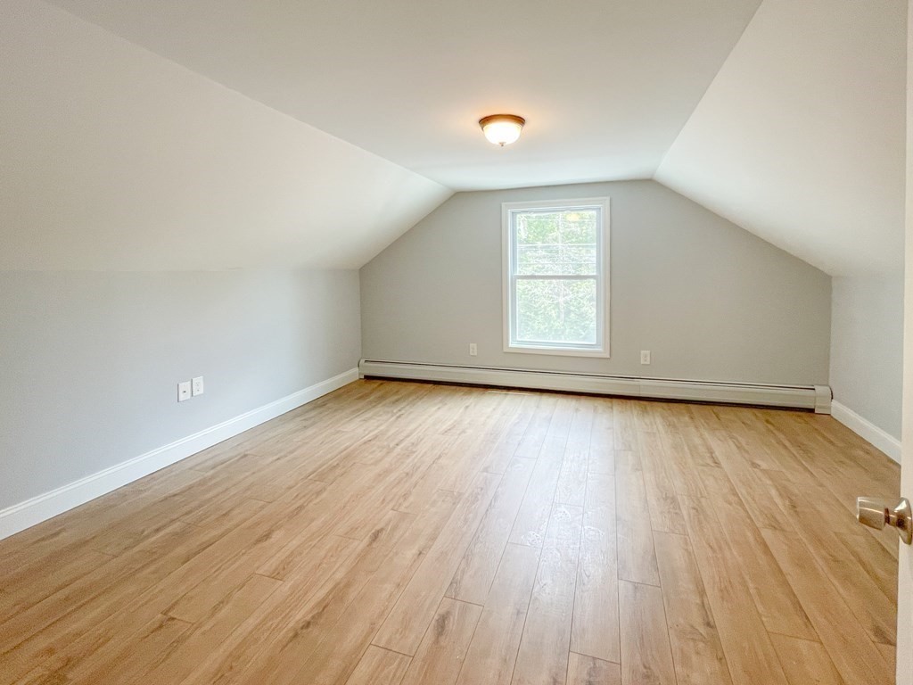 51 School Street North Barre, MA 01005 - Photo 22 of 35 an empty room with wooden floor and windows