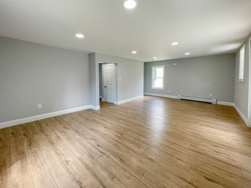 51 School Street North Barre, MA 01005 - Photo 24 of 35 an empty room with wooden floor and windows