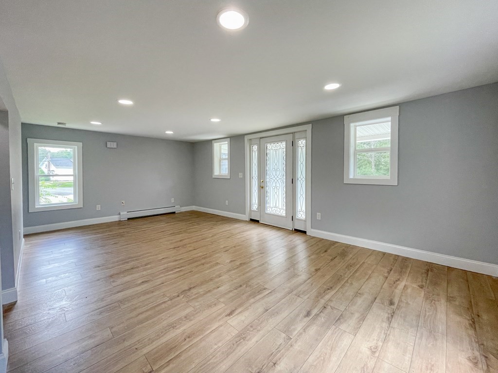 51 School Street North Barre, MA 01005 - Photo 25 of 35 an empty room with wooden floor and windows