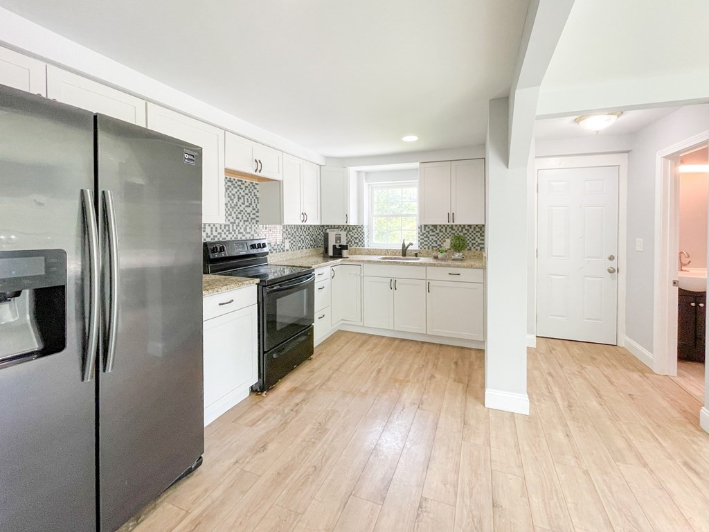 51 School Street North Barre, MA 01005 - Photo 26 of 35 a kitchen with stainless steel appliances granite countertop a refrigerator sink and microwave