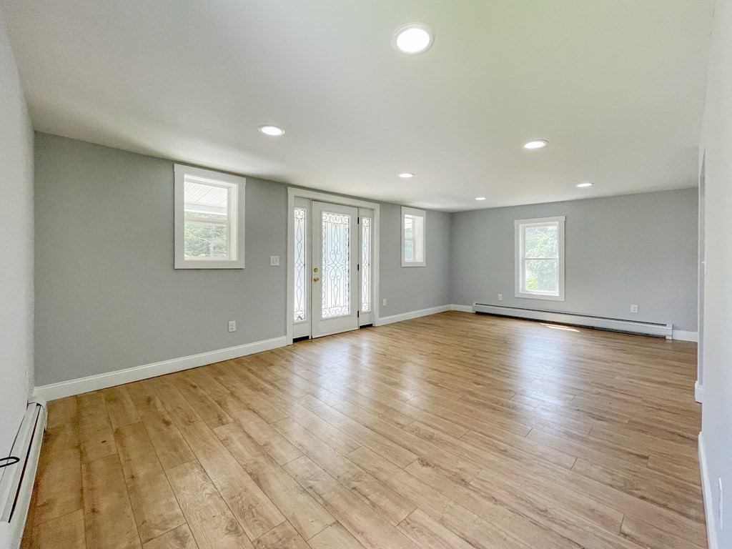 51 School Street North Barre, MA 01005 - Photo 27 of 35 a view of empty room with wooden floor and fan