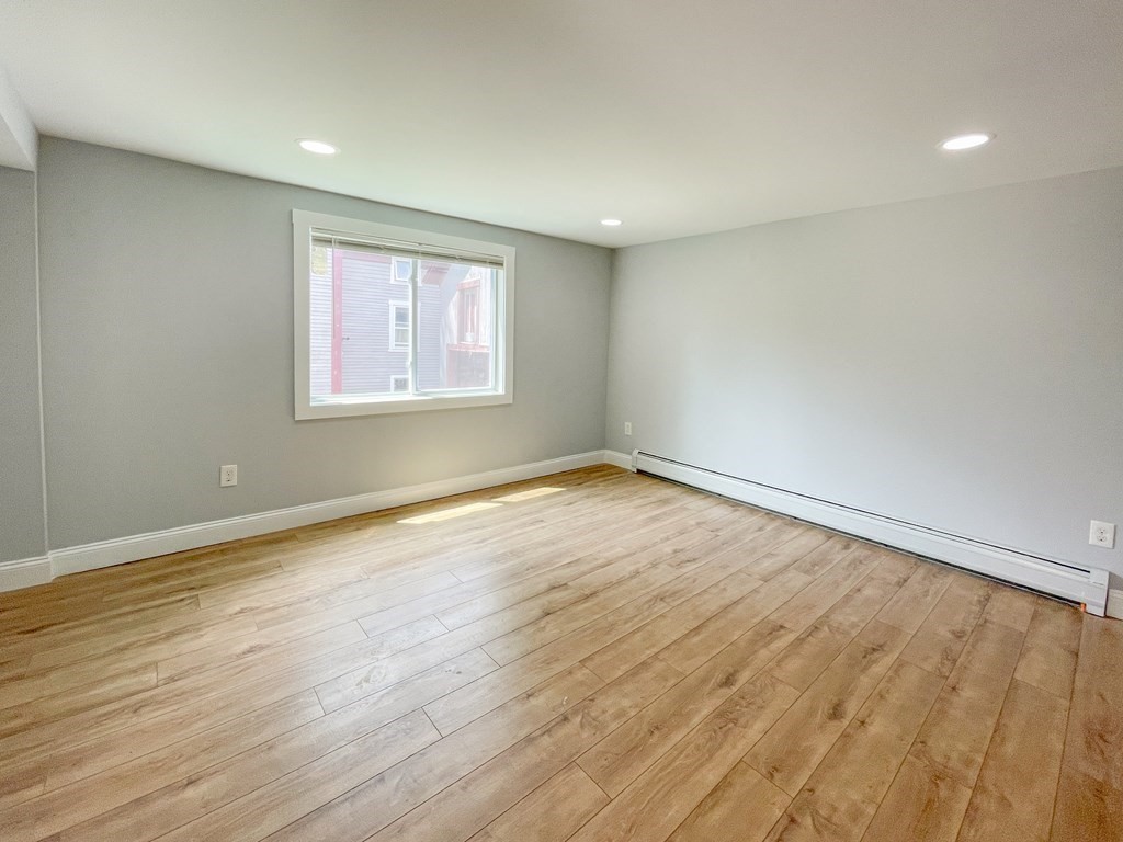 51 School Street North Barre, MA 01005 - Photo 28 of 35 an empty room with wooden floor and windows