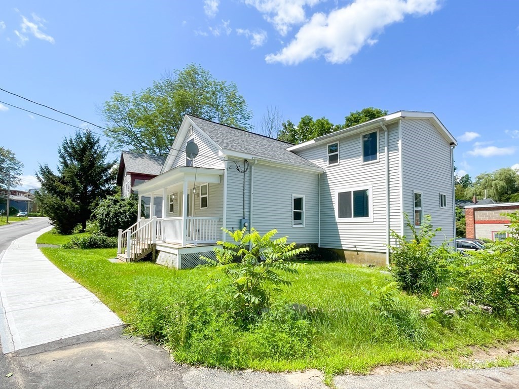 51 School Street North Barre, MA 01005 - Photo 3 of 35 a front view of a house with garden
