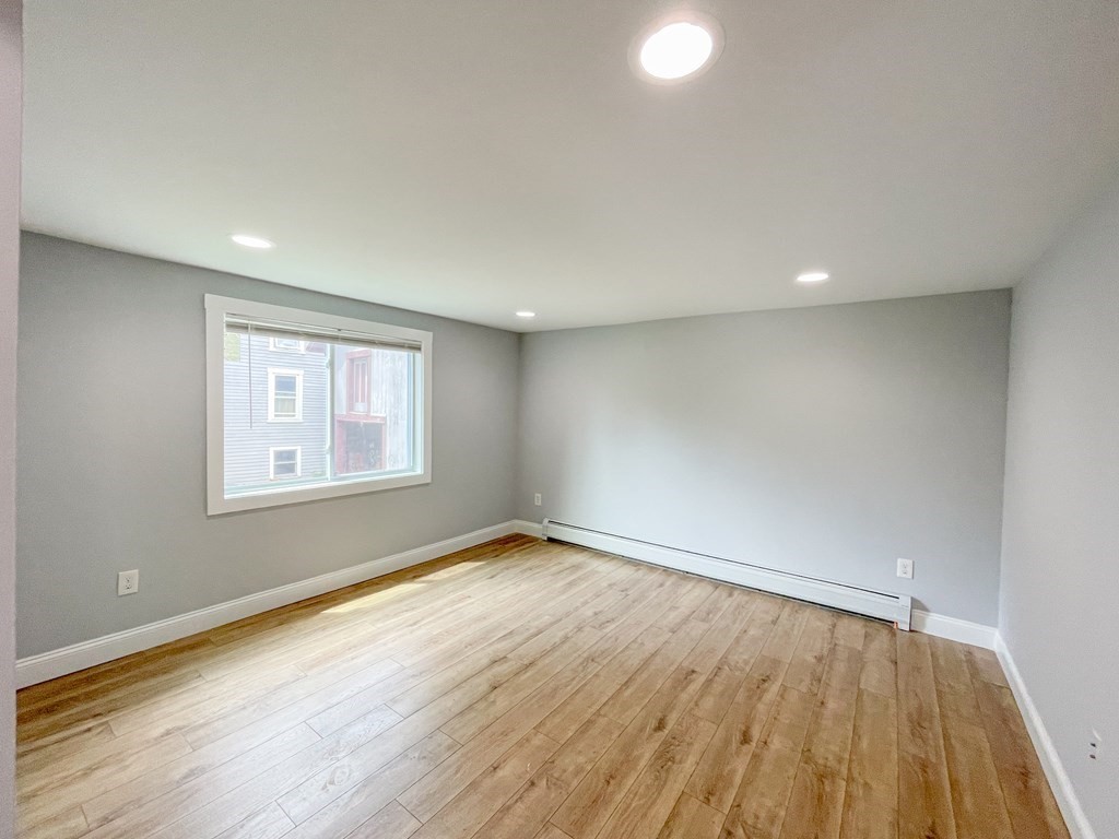 51 School Street North Barre, MA 01005 - Photo 31 of 35 an empty room with wooden floor and windows