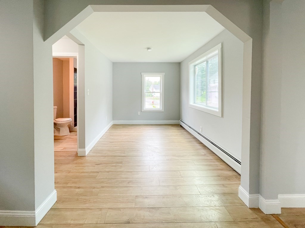 51 School Street North Barre, MA 01005 - Photo 32 of 35 a view of an empty room with wooden floor and a window