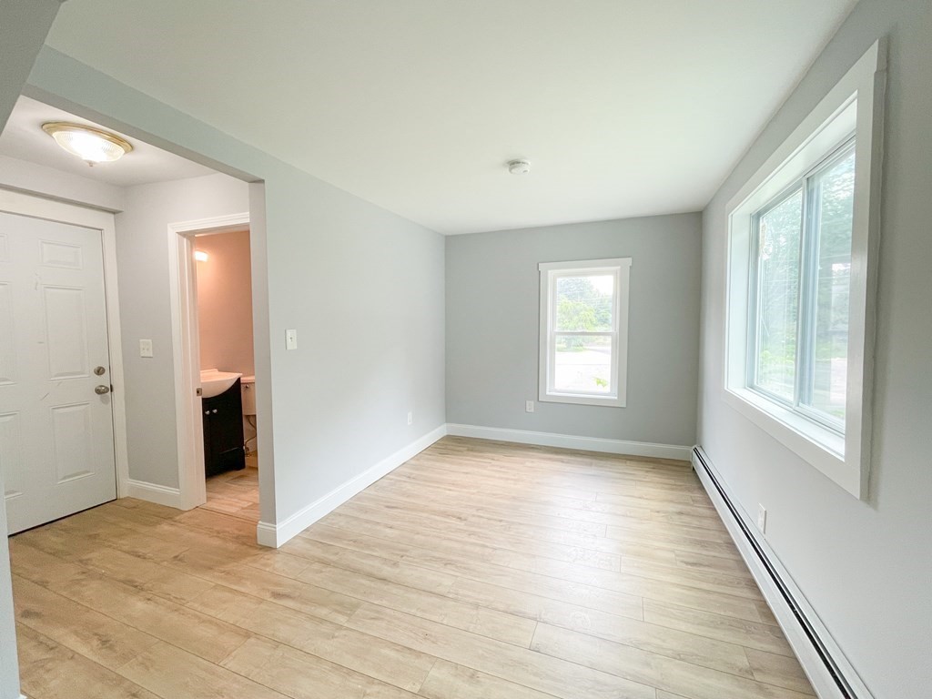 51 School Street North Barre, MA 01005 - Photo 33 of 35 a view of an empty room with wooden floor and a window