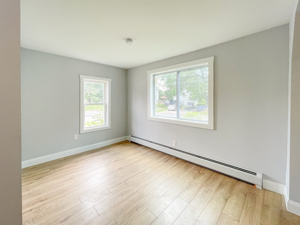 51 School Street North Barre, MA 01005 - Photo 34 of 35 a view of an empty room with a window and wooden floor