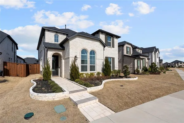 a front view of a house with yard