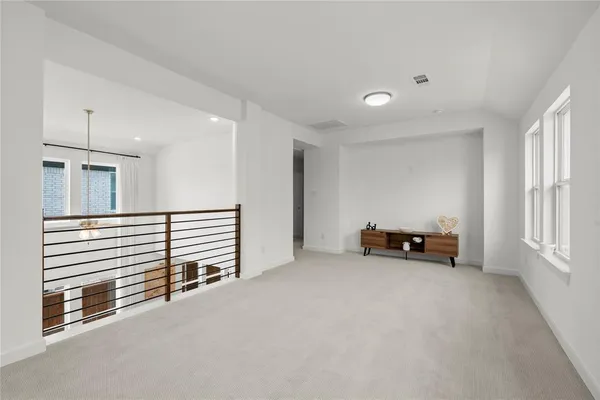 a view of a livingroom with furniture and staircase