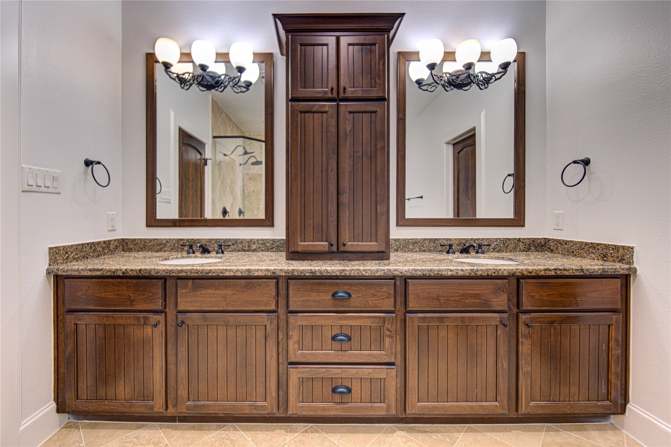 6520 Rodrigo Street Houston, TX 77007 - Photo 23 of 44 Primary bath with dual vanities, granite countertops, custom cabinetry, and generous storage