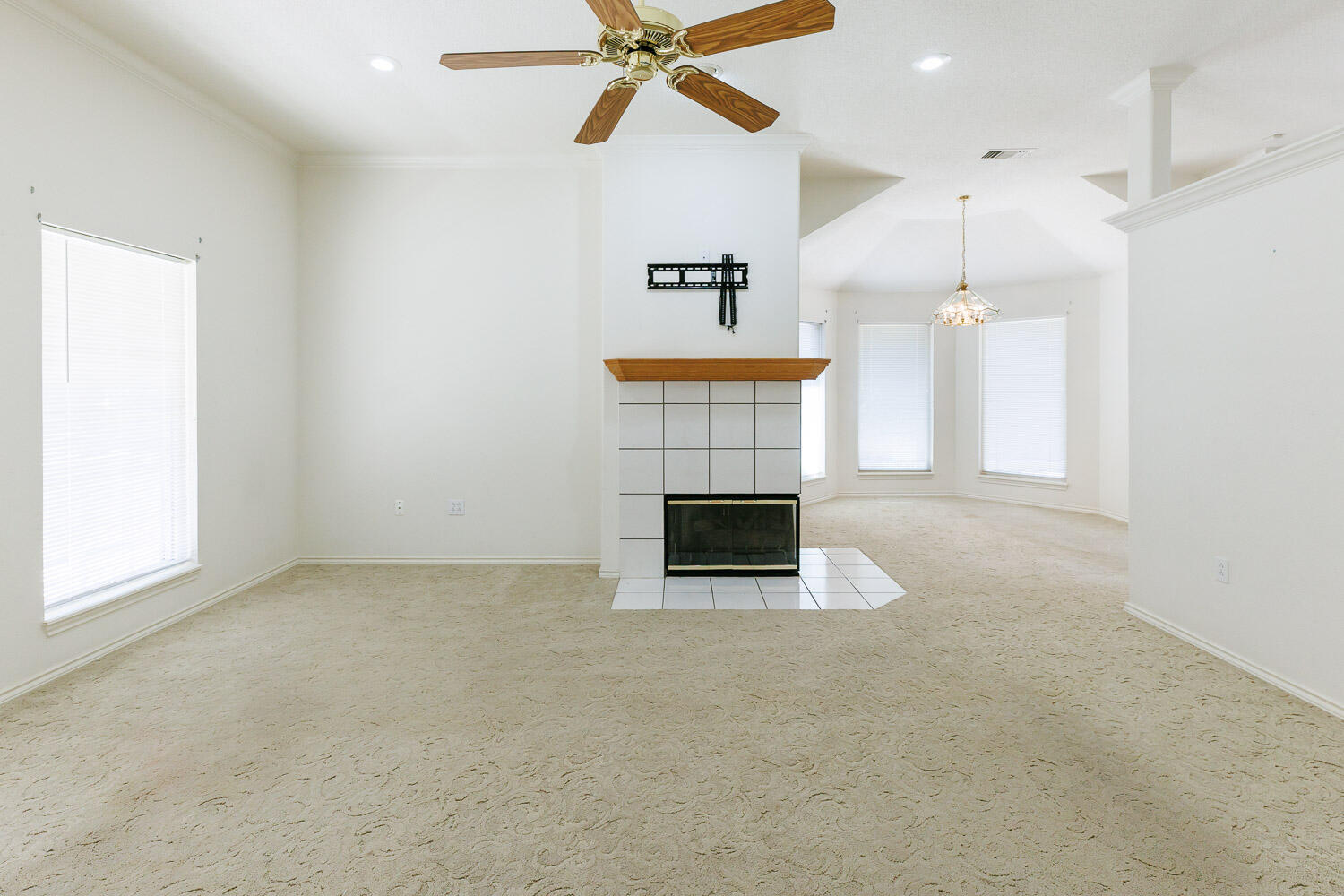 6904 Freeport Avenue Lubbock, TX 79424 - Photo 11 of 49 a view of an empty room with a fireplace