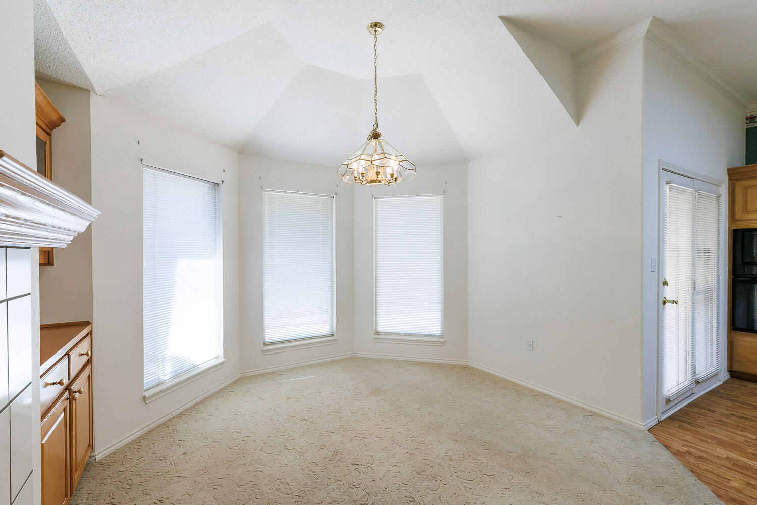 6904 Freeport Avenue Lubbock, TX 79424 - Photo 15 of 49 a view interior of a house with hallway window and chandelier