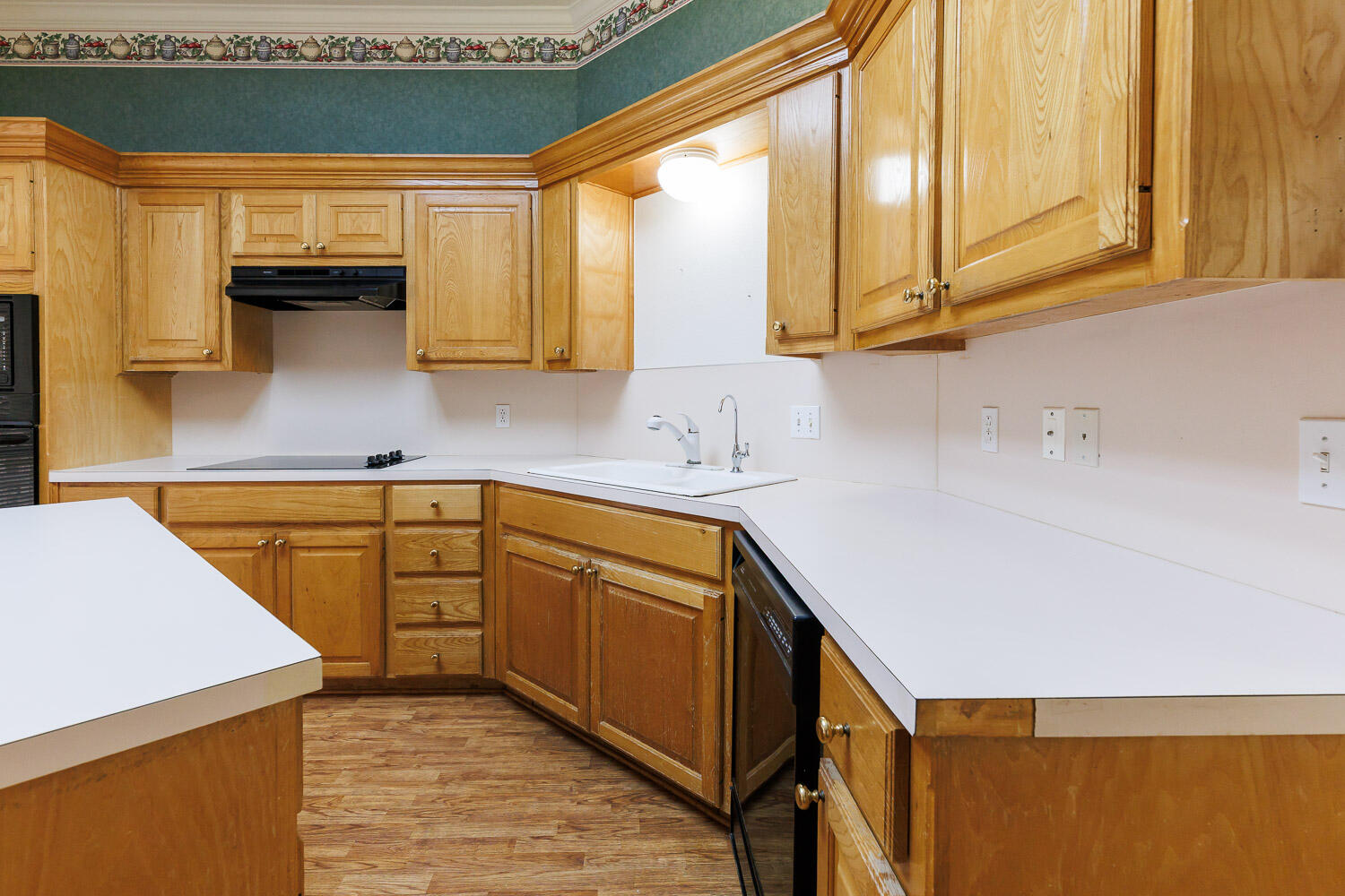 6904 Freeport Avenue Lubbock, TX 79424 - Photo 21 of 49 a kitchen with stainless steel appliances granite countertop a sink and a white cabinets