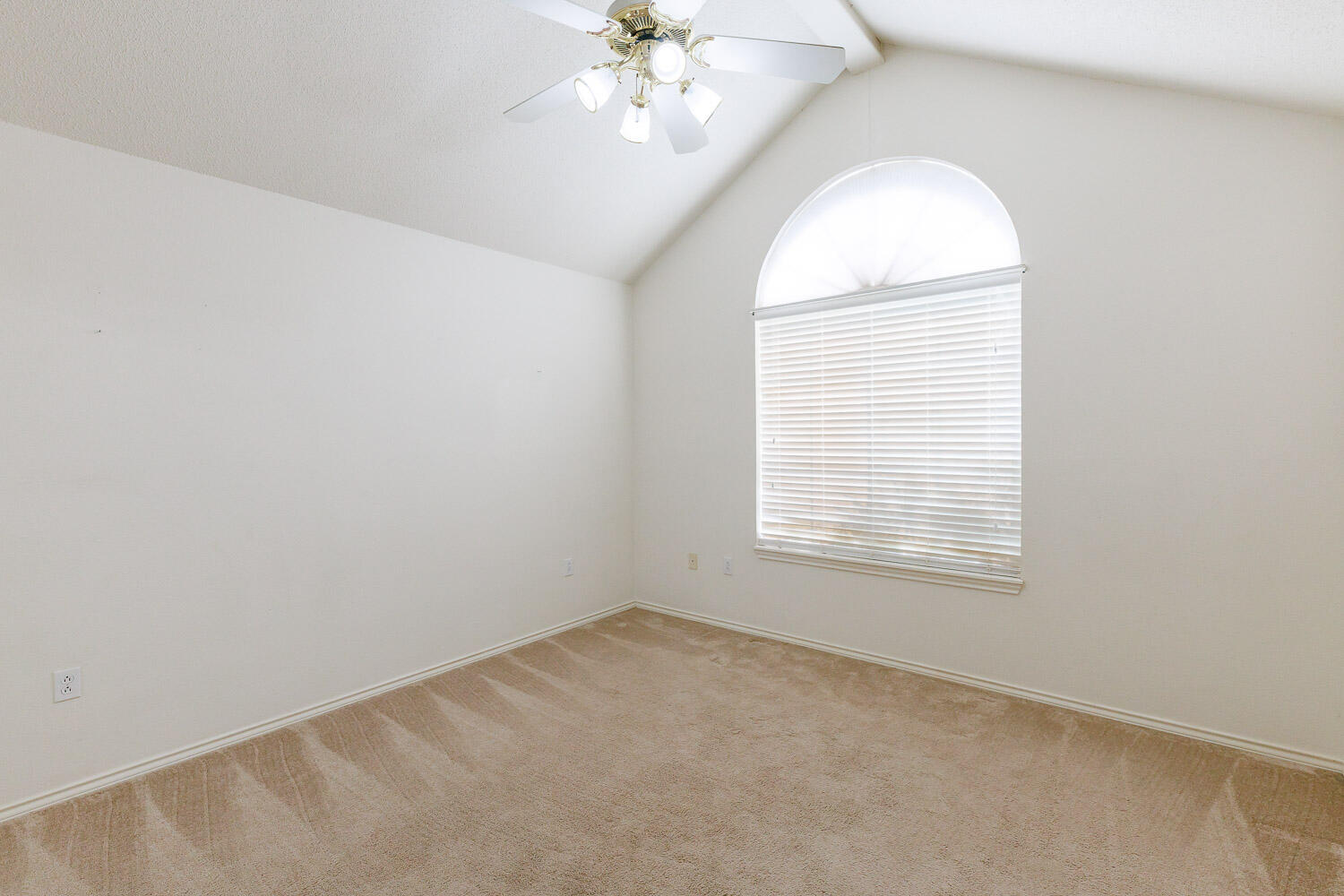 6904 Freeport Avenue Lubbock, TX 79424 - Photo 35 of 49 an empty room with a chandelier fan and windows