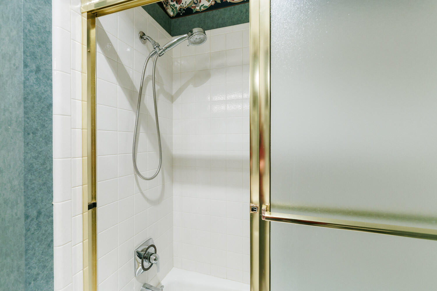 6904 Freeport Avenue Lubbock, TX 79424 - Photo 39 of 49 a bathroom with a glass shower door