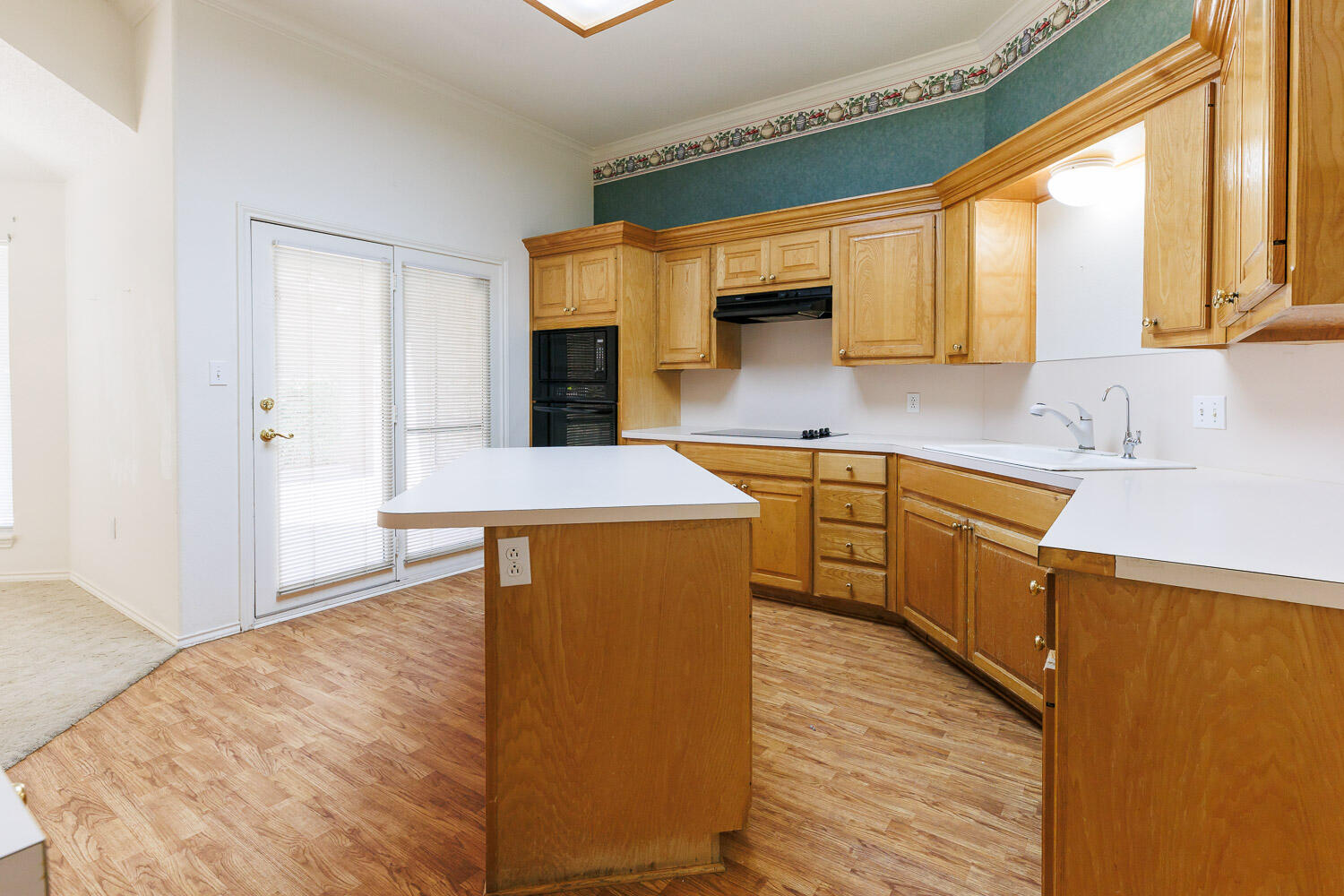 6904 Freeport Avenue Lubbock, TX 79424 - Photo 4 of 49 a kitchen with stainless steel appliances granite countertop a sink a stove and a refrigerator