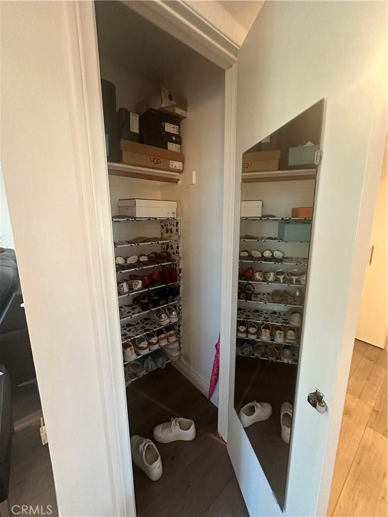 29 Woodleaf Irvine, CA 92614 - Photo 22 of 23 a view of walk in closet with clothes and shoes