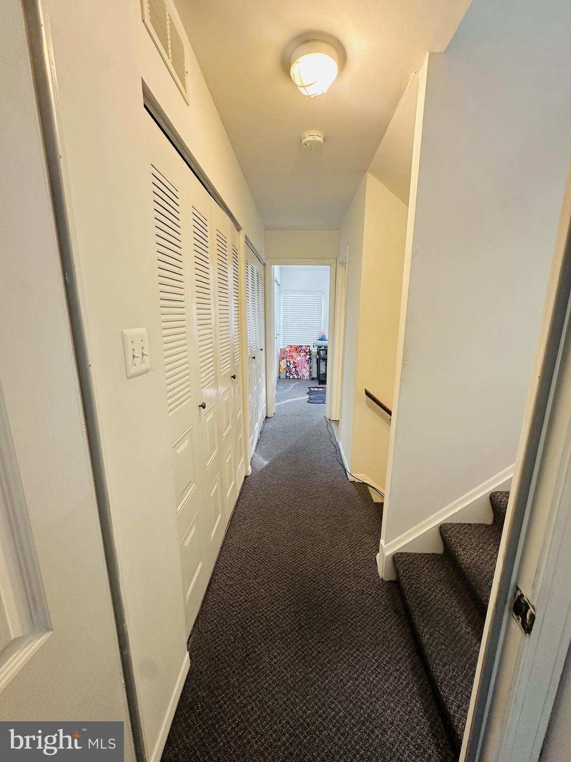 28 North Wolfe Street Baltimore, MD 21231 - Photo 23 of 25 a view of a hallway with furniture and front door