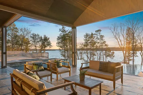 a view of a balcony with chairs and a table