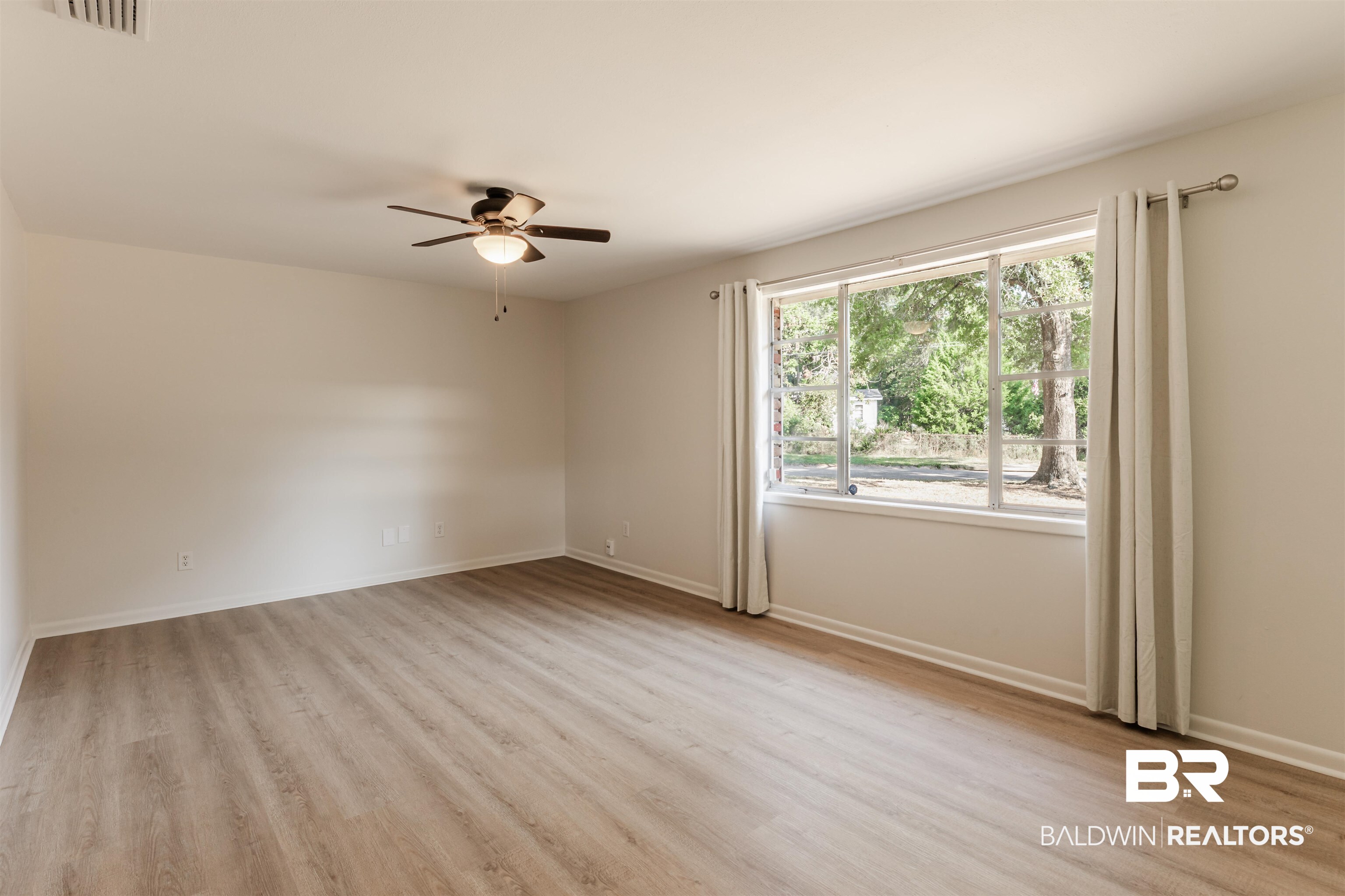 3970 Oak Ridge Avenue Mobile, AL 36619 - Photo 18 of 28 Empty room with ceiling fan and light hardwood / wood-style flooring