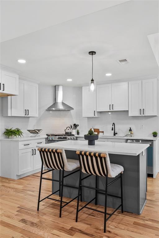 1883 Bennett Ridge Southwest Snellville, GA 30078 - Photo 17 of 56 a kitchen with a table chairs stove and cabinets