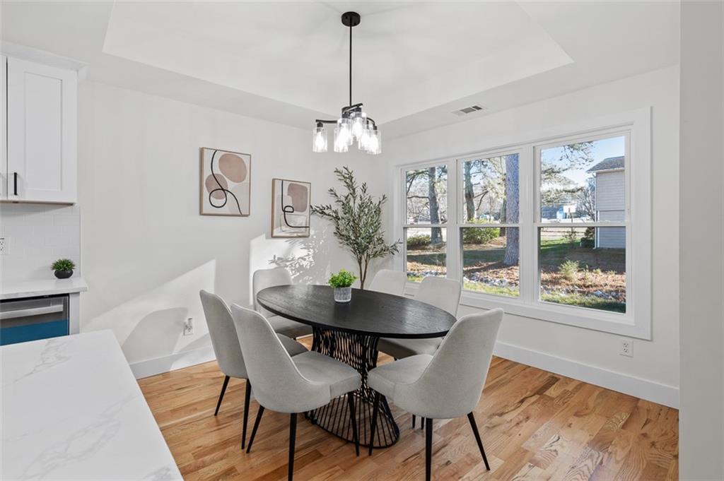 1883 Bennett Ridge Southwest Snellville, GA 30078 - Photo 18 of 56 a view of a dining room with furniture window and wooden floor