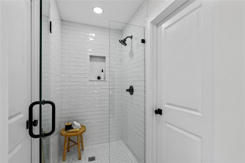 1883 Bennett Ridge Southwest Snellville, GA 30078 - Photo 27 of 56 a bathroom with a shower