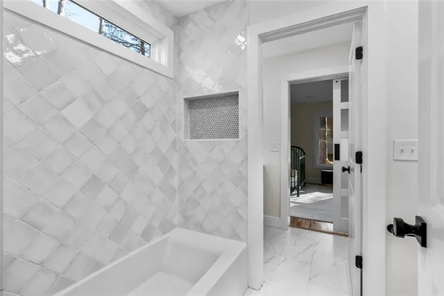 a view of an entryway with wooden floor