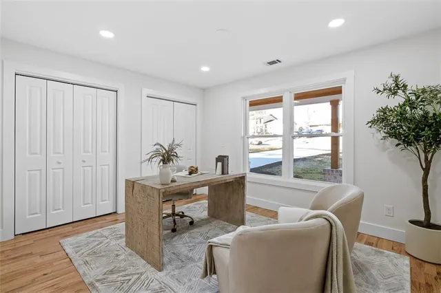 a view of hallway with wooden floor