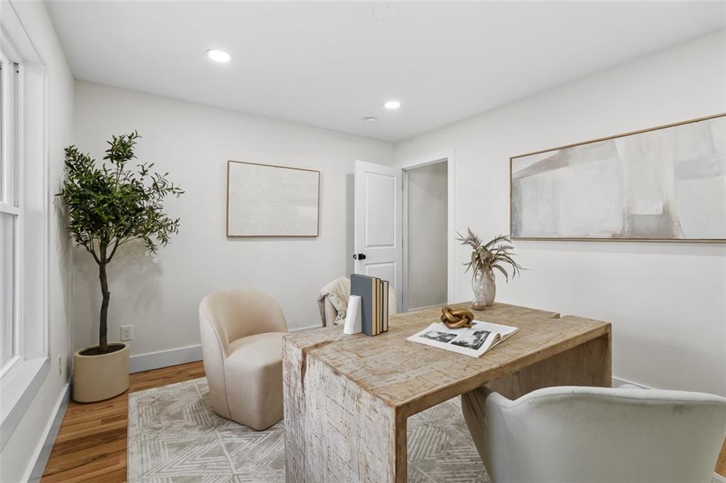 1883 Bennett Ridge Southwest Snellville, GA 30078 - Photo 40 of 56 a living room with furniture and a potted plant