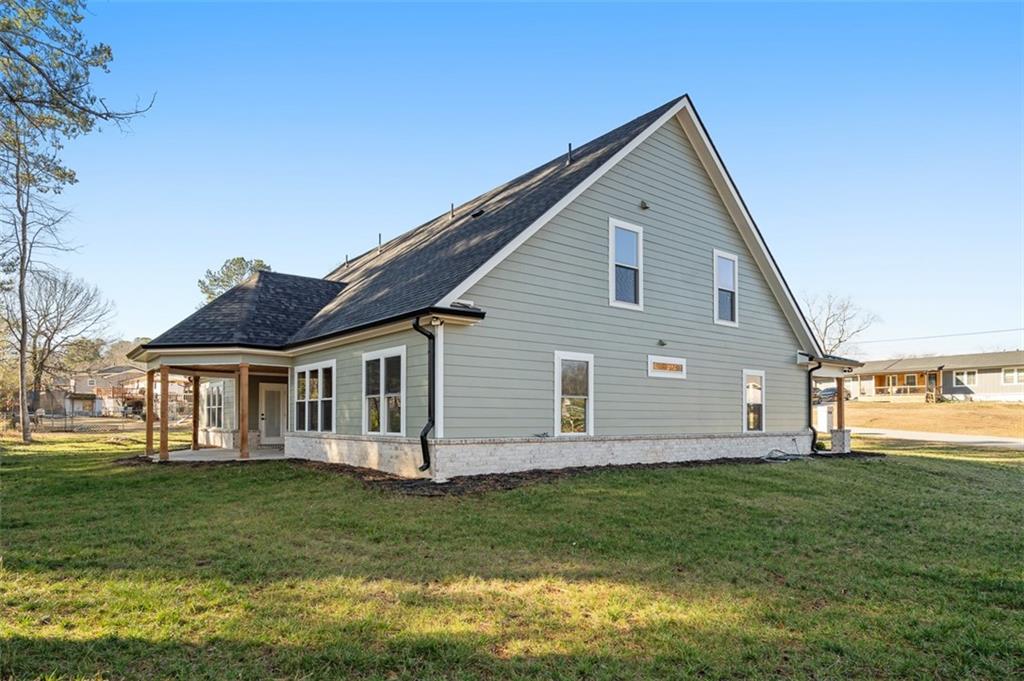 1883 Bennett Ridge Southwest Snellville, GA 30078 - Photo 54 of 56 a front view of house with yard and green space
