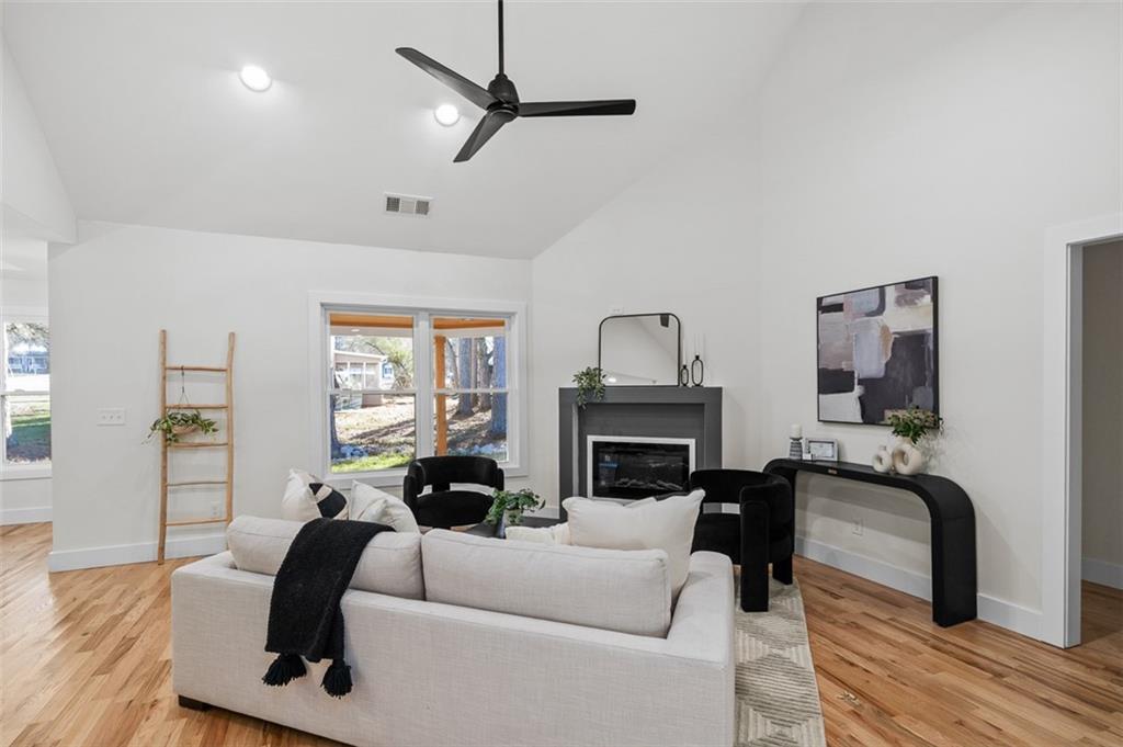 1883 Bennett Ridge Southwest Snellville, GA 30078 - Photo 7 of 56 a living room with furniture and a fireplace