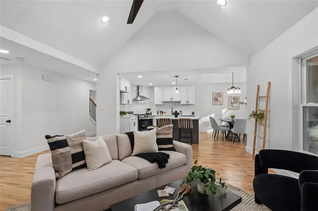 a living room with furniture and a fireplace
