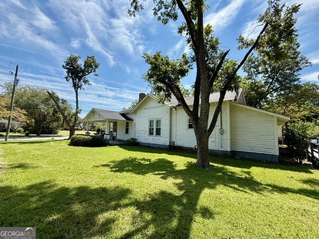 450 South Rountree Street Metter, GA 30439 - Photo 15 of 17 a view of a house with a yard