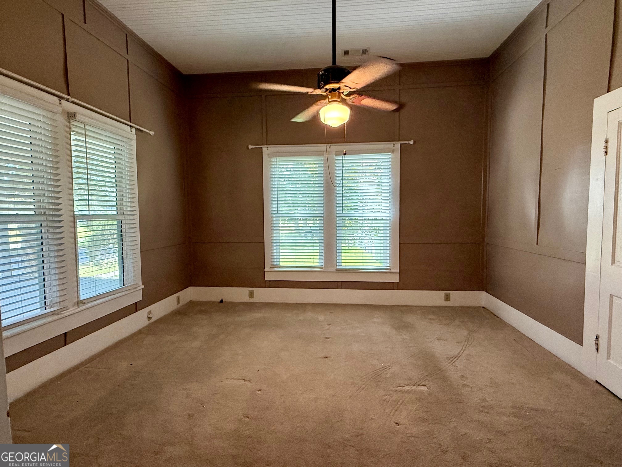 450 South Rountree Street Metter, GA 30439 - Photo 3 of 17 a view of an empty room with a window