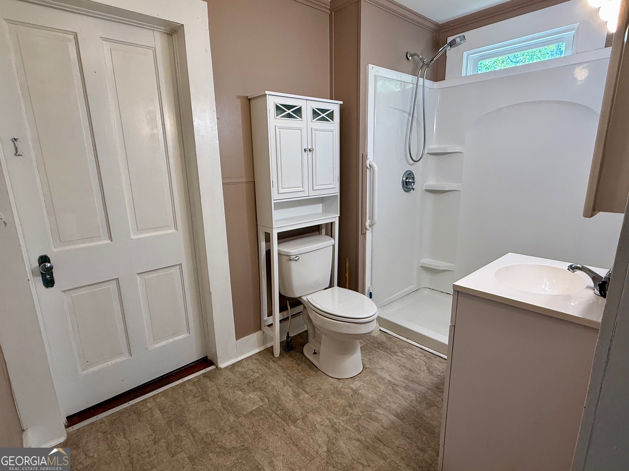 450 South Rountree Street Metter, GA 30439 - Photo 8 of 17 a white toilet sitting next to a bathroom sink