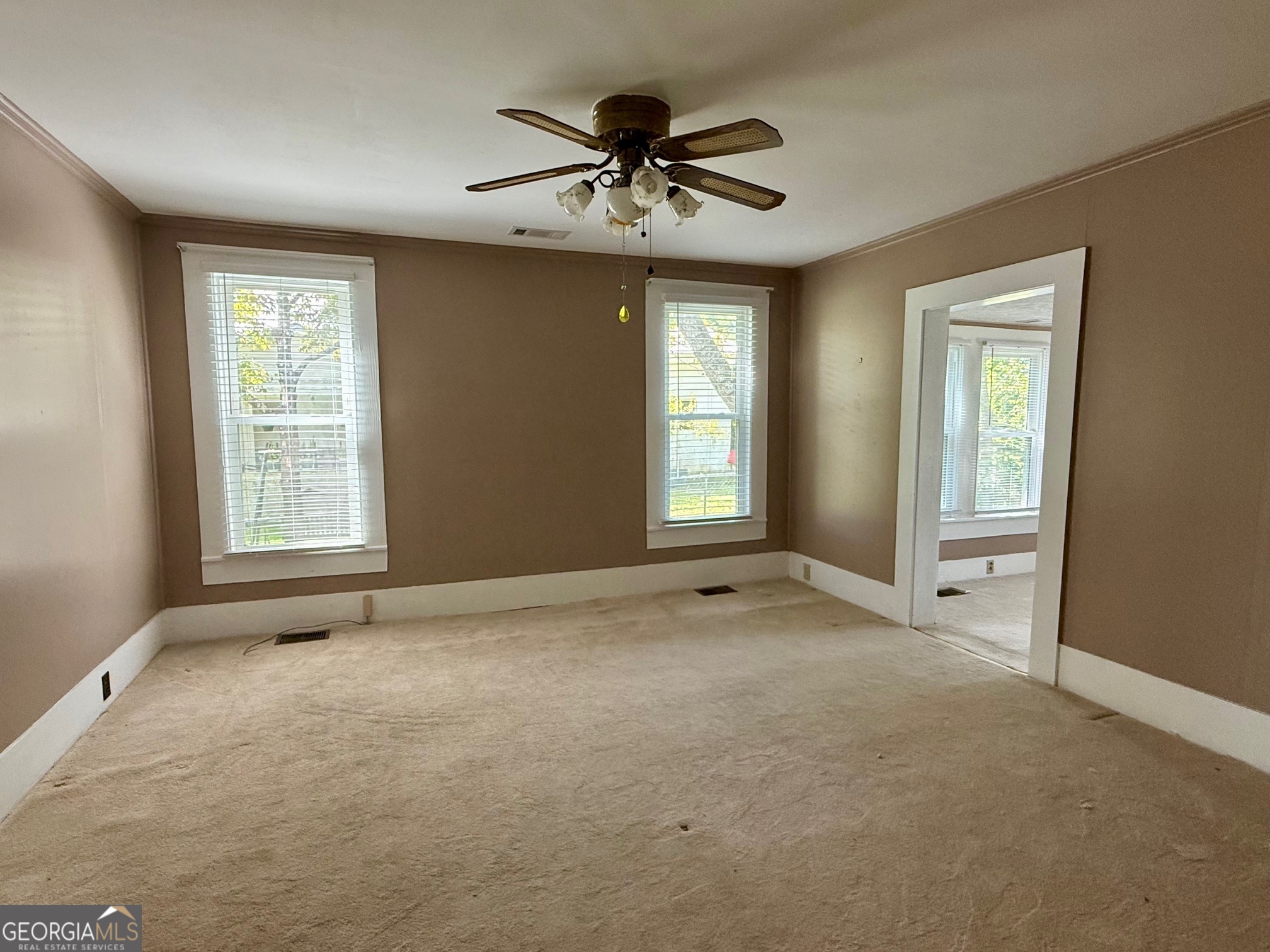 450 South Rountree Street Metter, GA 30439 - Photo 9 of 17 a view of an empty room with a window