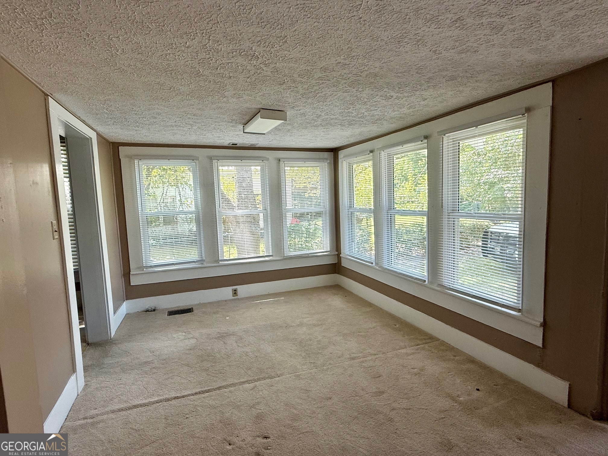 450 South Rountree Street Metter, GA 30439 - Photo 10 of 17 a view of an empty room with a window