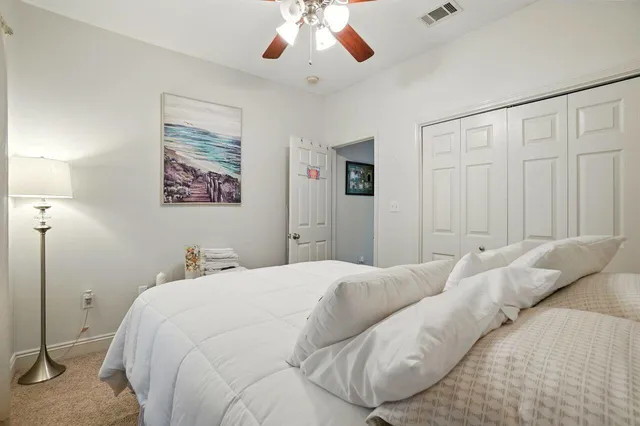 a bed room with a bed and a painting