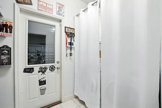 a view of washer and dryer with kitchen in the background