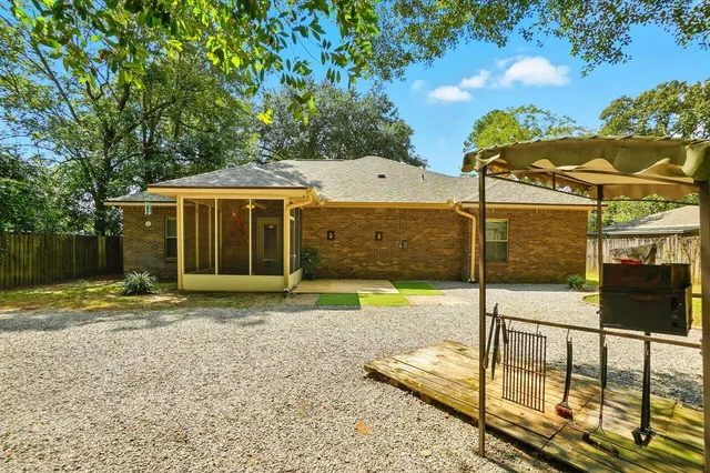 a view of a house with backyard space and balcony
