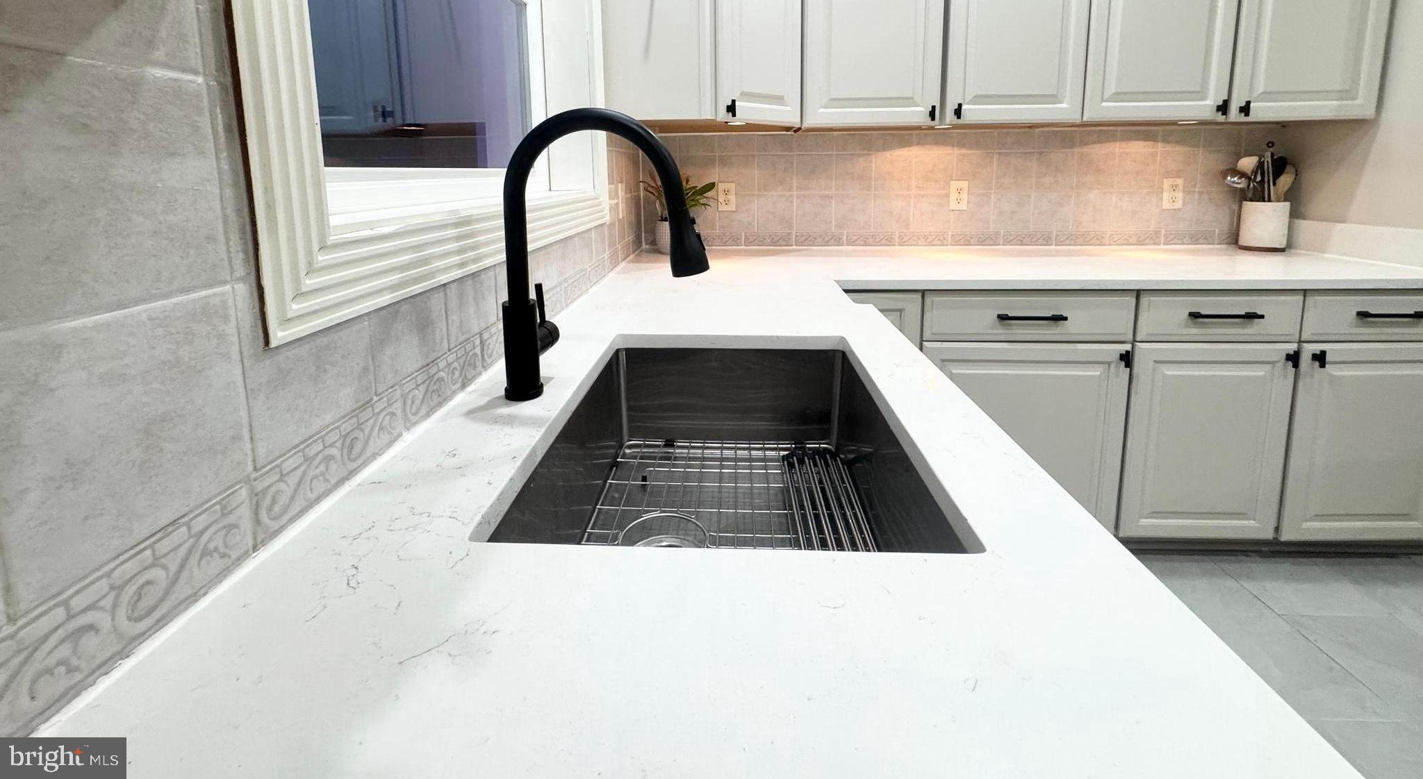 6 Cinderberry Court Georgetown, DE 19947 - Photo 17 of 117 a kitchen with a sink a stove and cabinets