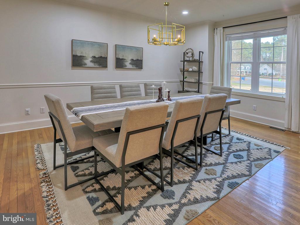 6 Cinderberry Court Georgetown, DE 19947 - Photo 69 of 117 a dining room with furniture and wooden floor