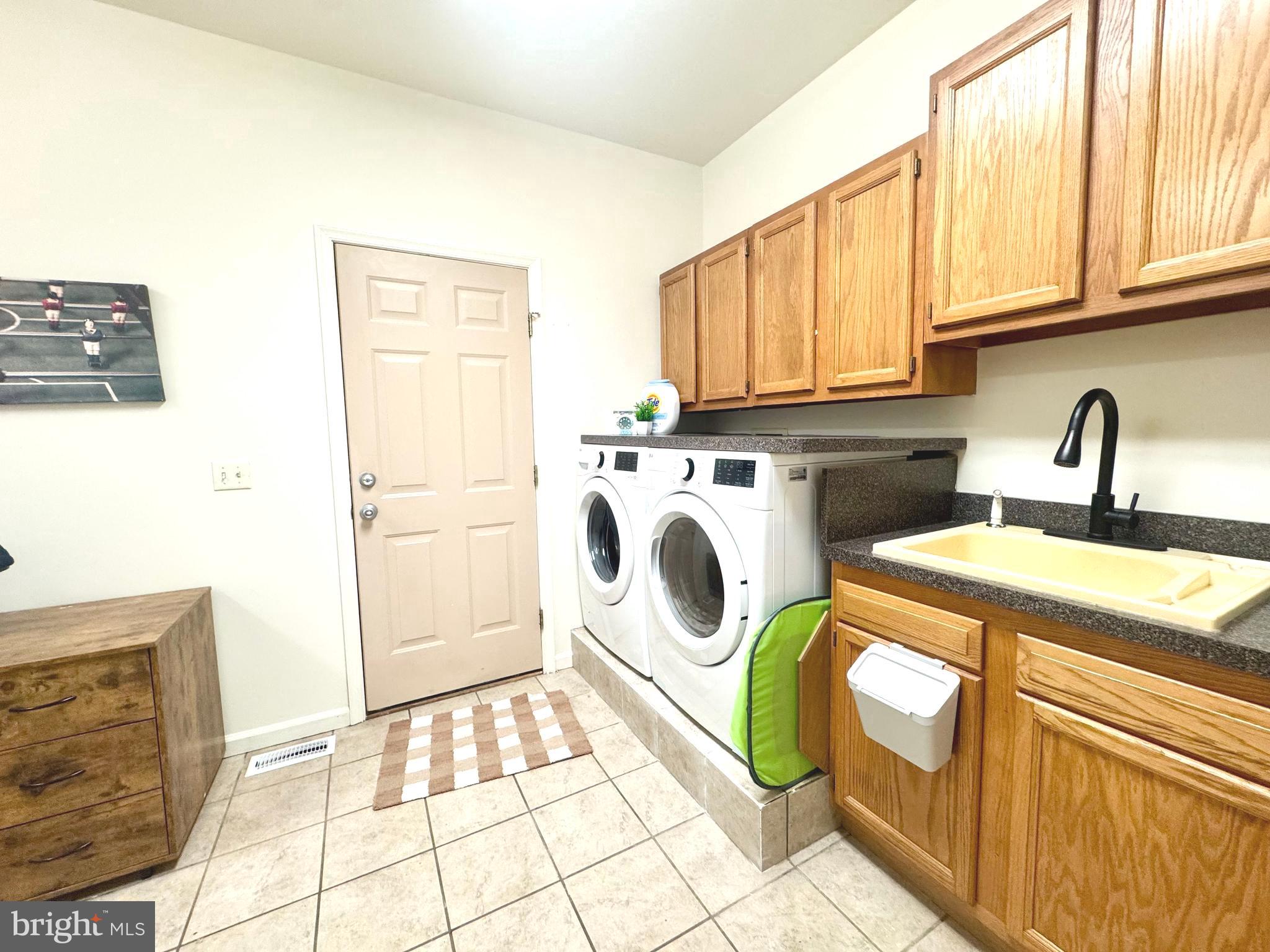 6 Cinderberry Court Georgetown, DE 19947 - Photo 88 of 117 a kitchen with a sink a stove and white cabinets